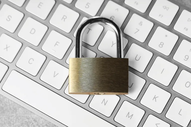 Metal padlock on a computer keyboard symbolizing cybersecurity credential protection and access control